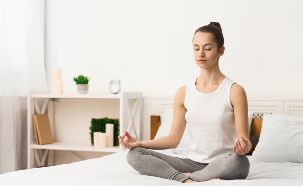 woman meditating and practicing yoga