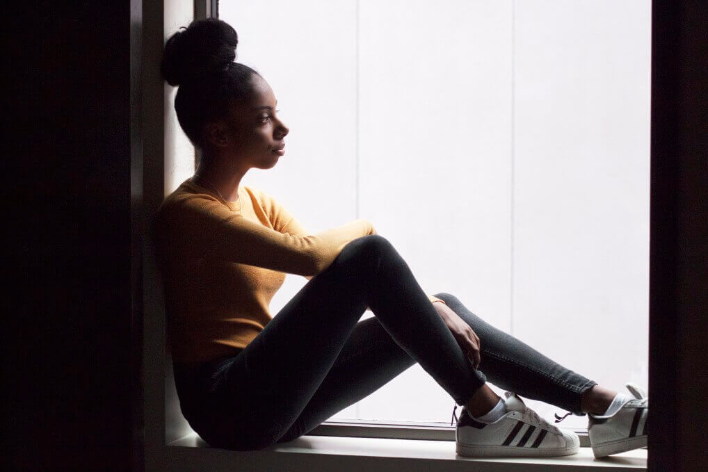 african american woman by the window depression treatment esketamine