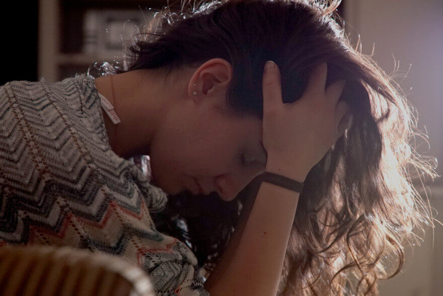 klonopin addiction young girl with her head in her hands