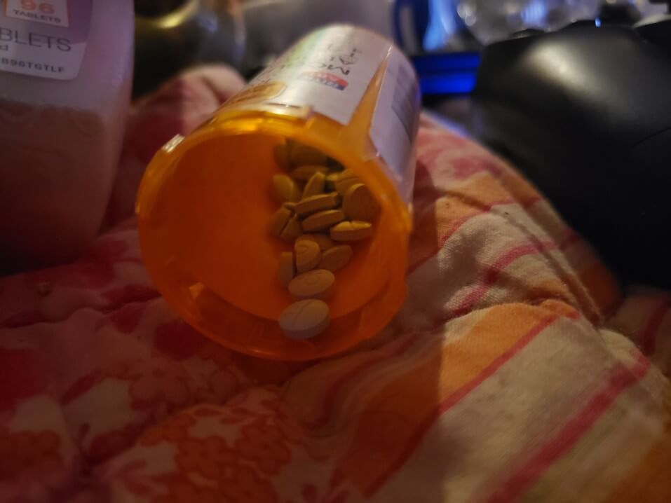 xanax abuse rehab pills bottle orange spilled bed pharma blanket