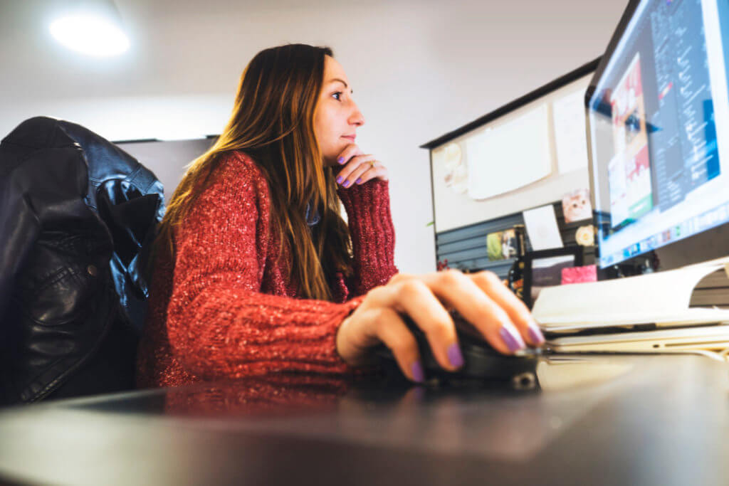 woman working hard at her desk life balance