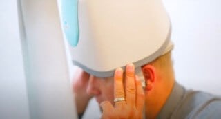 tms therapy san diego depression ocd pain man hat hand