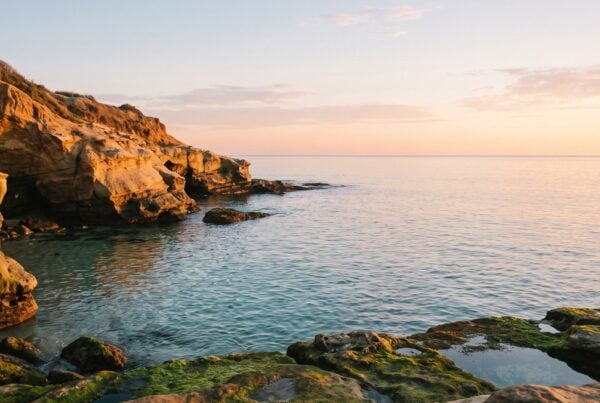 Calm sunrise over La Jolla Cove with open horizon reflecting clarity about insurance coverage for rehab in California