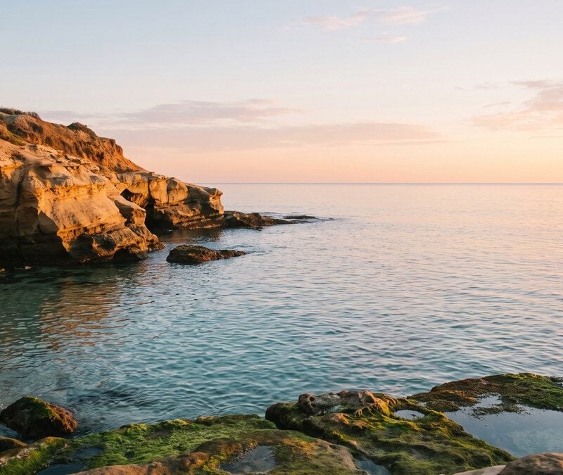 Calm sunrise over La Jolla Cove with open horizon reflecting clarity about insurance coverage for rehab in California